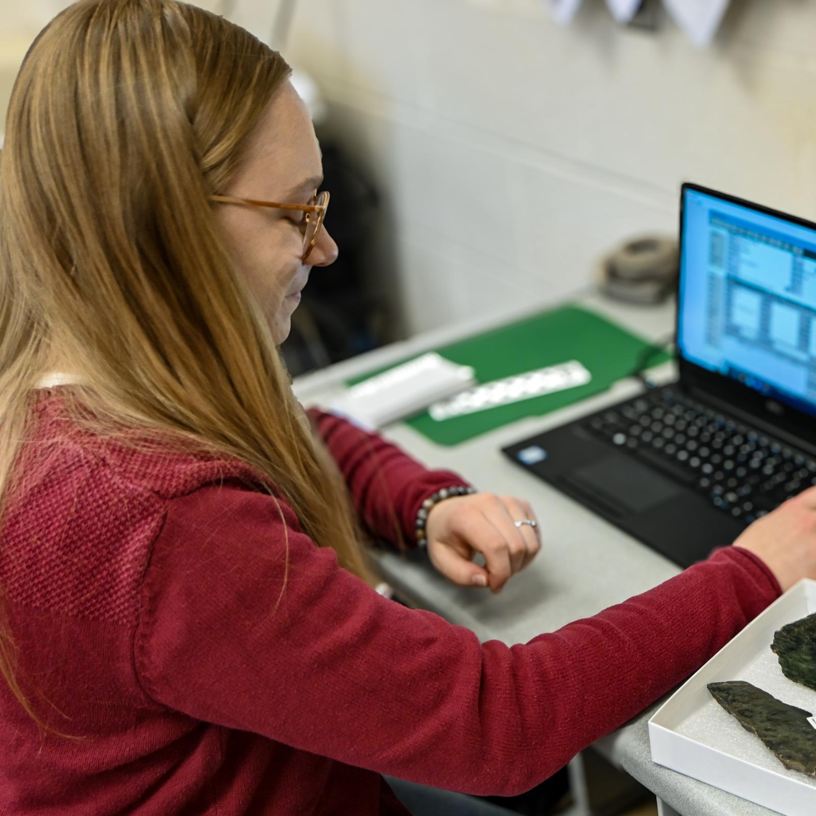 Student intern working in museum collections Student intern working in museum collections